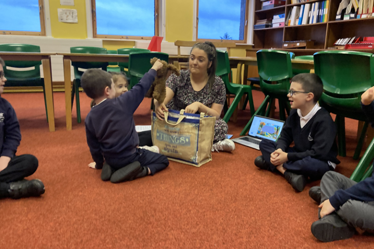 Pupils engaging in ceolmhor project with a teacher