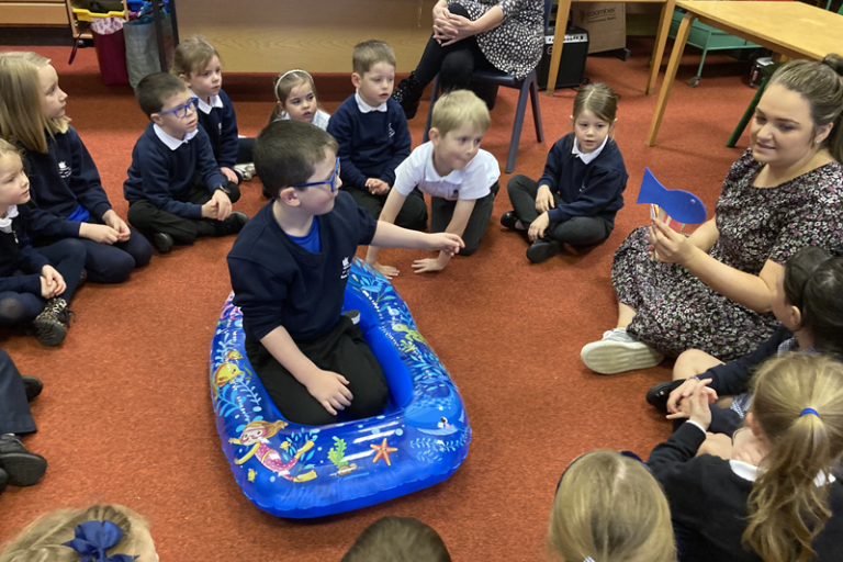 Pupils engaging in ceolmhor project with a teacher