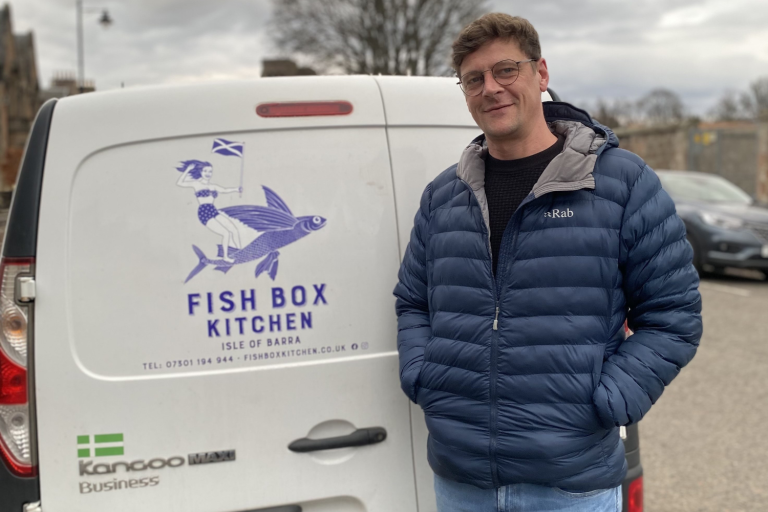 Thomas in front of his Fish Box Kitchen van